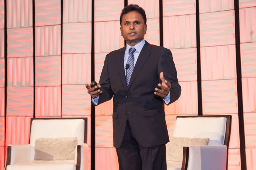 Tel K. Ganesan delivering a keynote address on stage